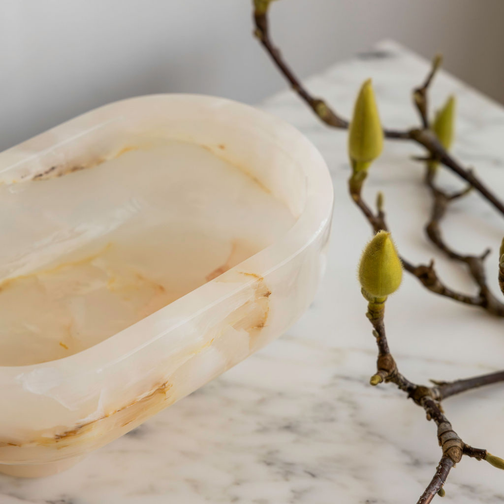 The Muse footed oval tray in White Onyx with elegant design, inspired by Greek artistry, perfect for upscale decor and thoughtful display in luxury interiors