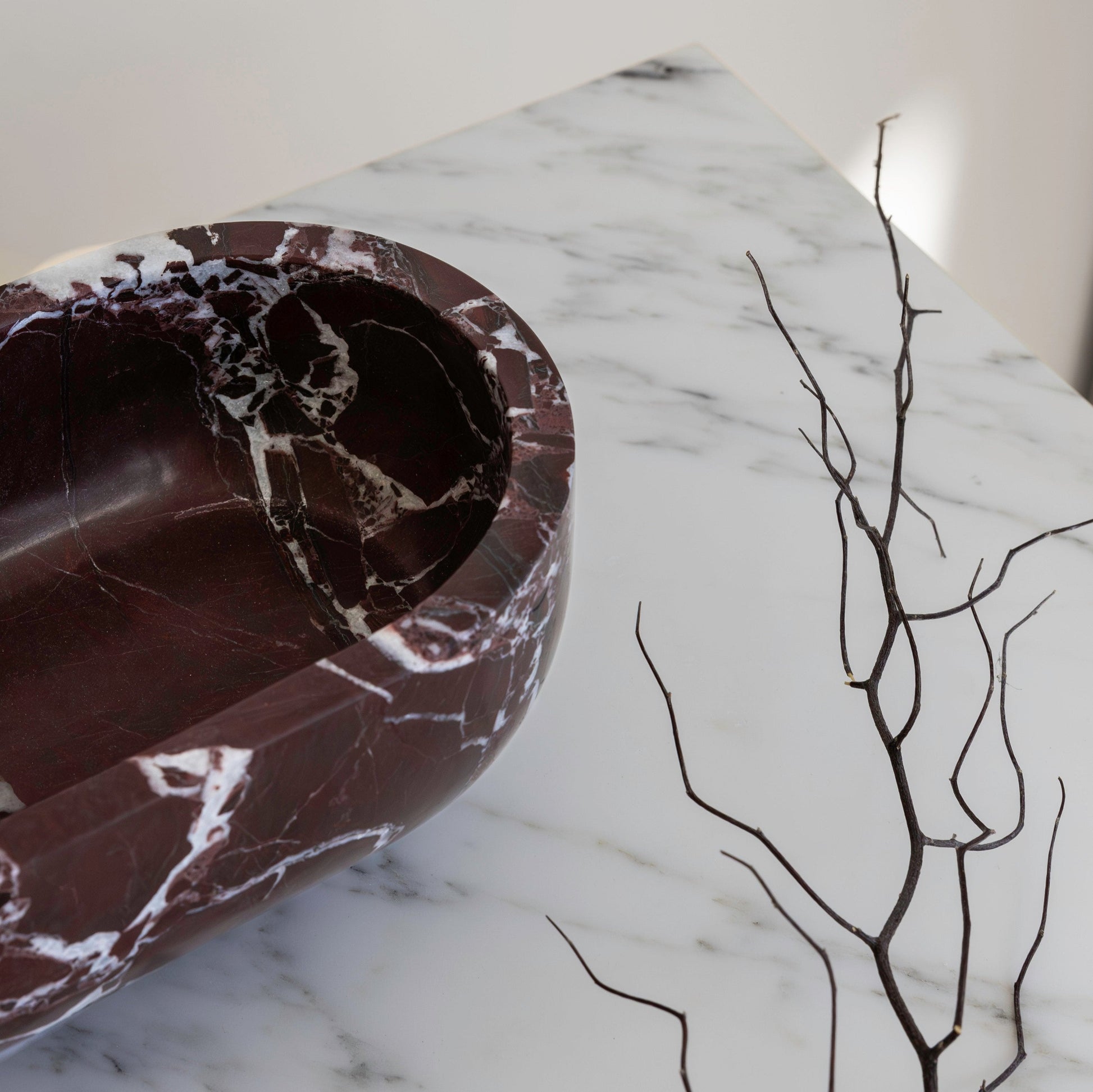 The Muse footed oval tray in Rosso Levanto with elegant design, inspired by Greek artistry, perfect for upscale decor and thoughtful display in luxury interiors